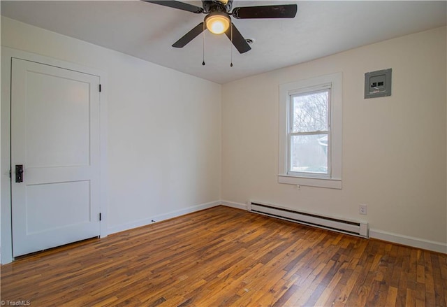 spare room with a ceiling fan, a baseboard radiator, baseboards, and hardwood / wood-style floors