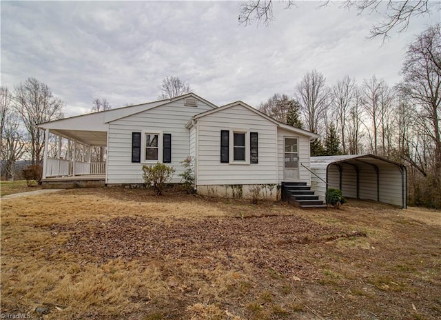 exterior space with a carport and a porch