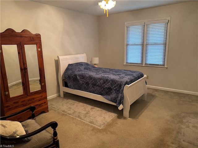 bedroom featuring baseboards and carpet floors