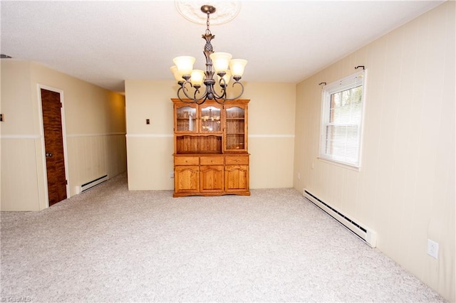 interior space featuring an inviting chandelier and a baseboard radiator