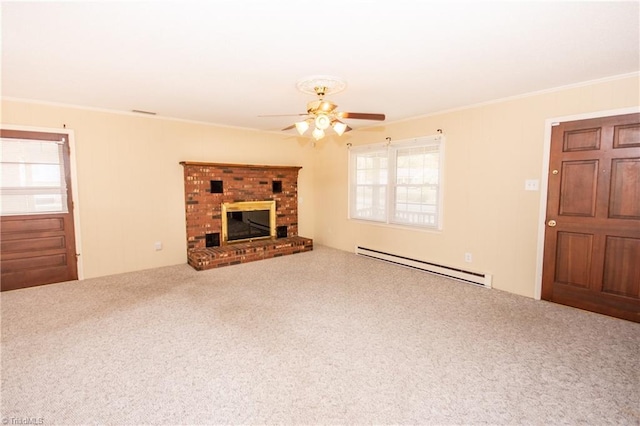 unfurnished living room with ceiling fan, baseboard heating, carpet, a fireplace, and ornamental molding