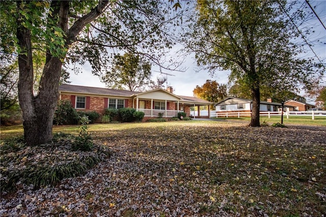 ranch-style home with a porch