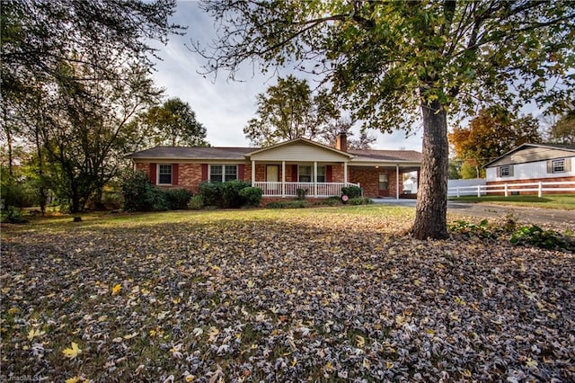 ranch-style house with covered porch