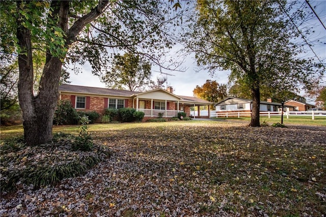 ranch-style house with covered porch