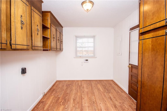 laundry room with light hardwood / wood-style flooring