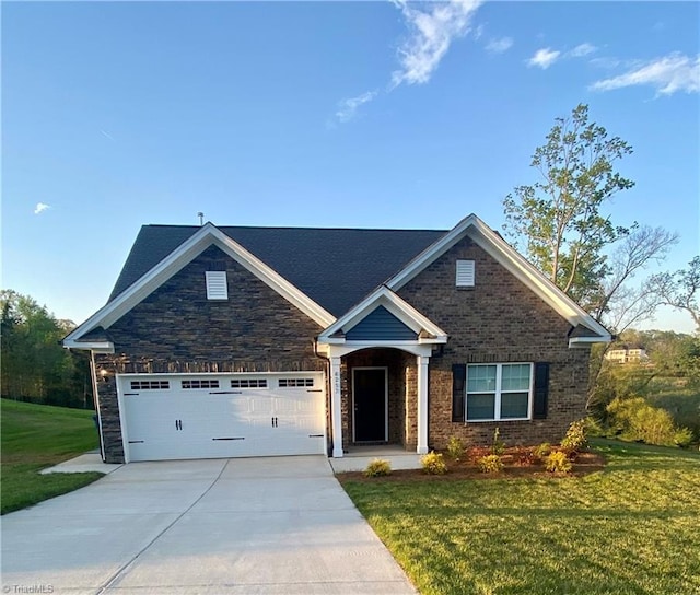 craftsman house with a front lawn and a garage