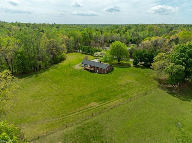 drone / aerial view with a forest view and a rural view