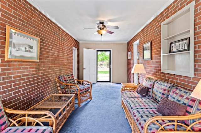 carpeted living room with brick wall, ornamental molding, and ceiling fan