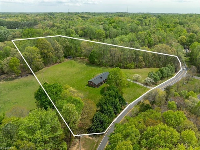 aerial view with a view of trees and a rural view