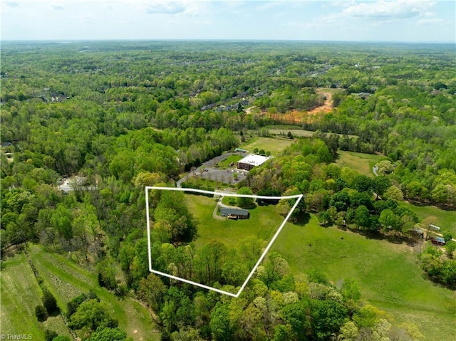 aerial view featuring a view of trees