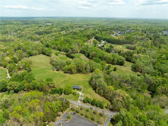 aerial view featuring a forest view