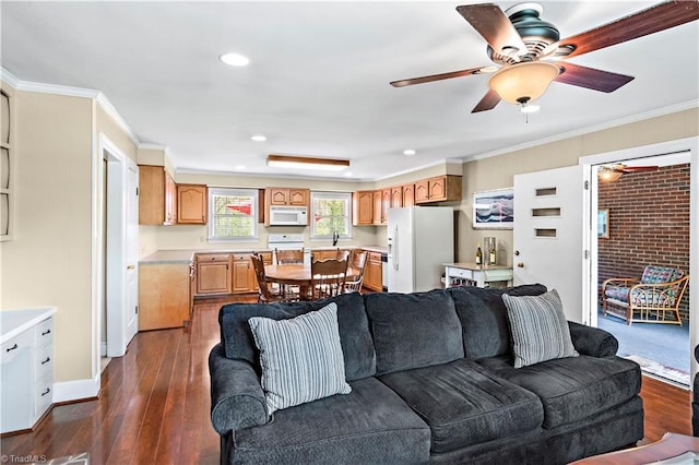 living area featuring recessed lighting, crown molding, dark wood-style floors, and ceiling fan