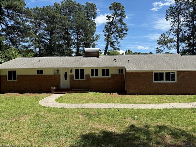 4115 Rose Lake Dr, Greensboro, NC 27407 - view of front of home featuring brick siding, a front yard, and roof with shingles