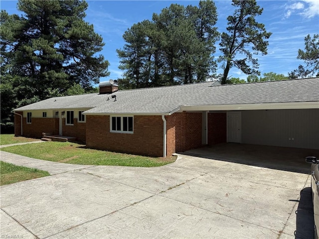 4115 Rose Lake Dr, Greensboro, NC 27407 - view of front of home with concrete driveway, brick siding, a shingled roof, and a chimney