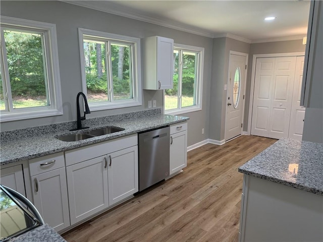 4115 Rose Lake Dr, Greensboro, NC 27407 - kitchen with dishwasher, a sink, white cabinets, crown molding, and light wood-style floors