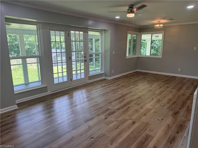 4115 Rose Lake Dr, Greensboro, NC 27407 - unfurnished room with baseboards, ornamental molding, plenty of natural light, ceiling fan, and wood finished floors