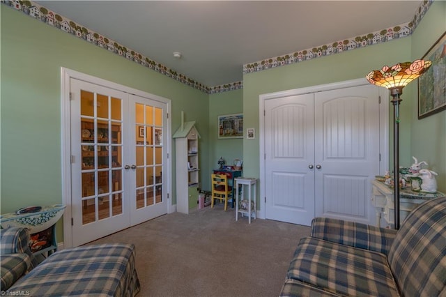 living area featuring carpet and french doors