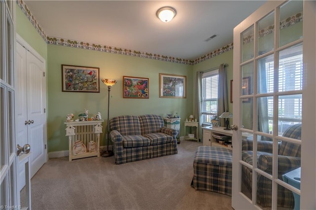 sitting room featuring french doors, carpet flooring, visible vents, and baseboards