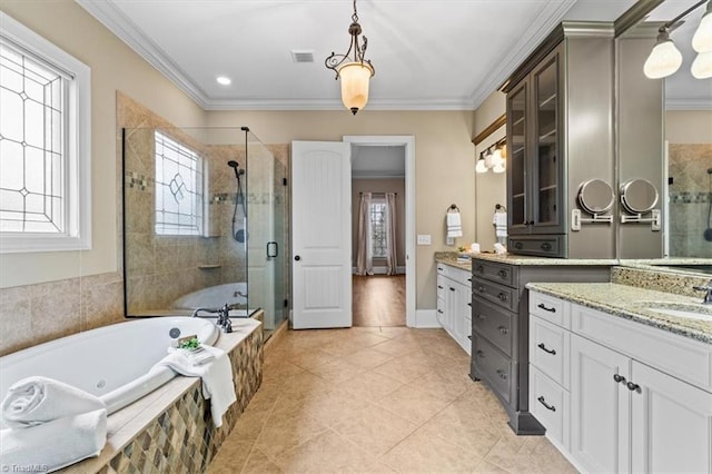 bathroom with crown molding, a bath, visible vents, and a shower stall