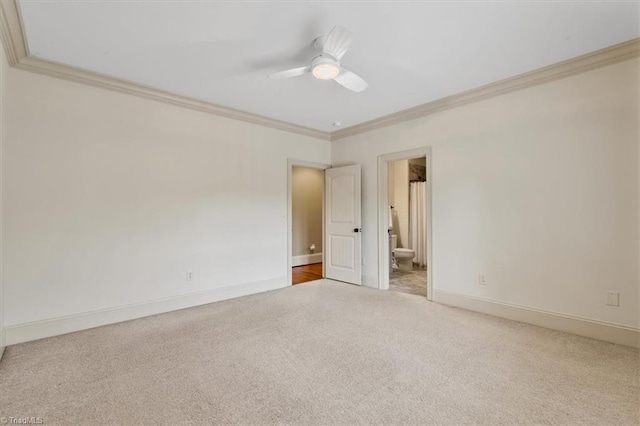 empty room with ceiling fan, baseboards, carpet floors, and ornamental molding