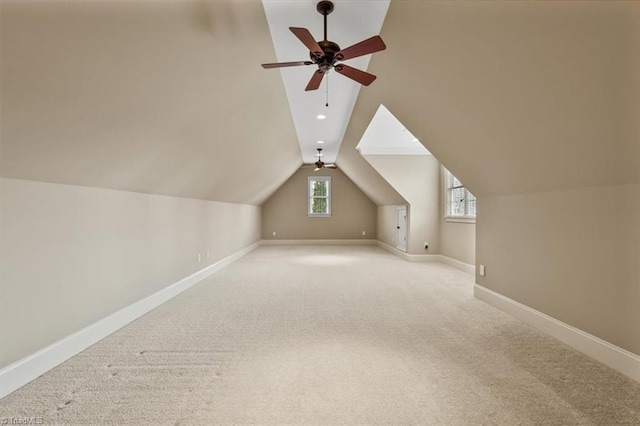 bonus room featuring carpet, baseboards, ceiling fan, lofted ceiling, and recessed lighting