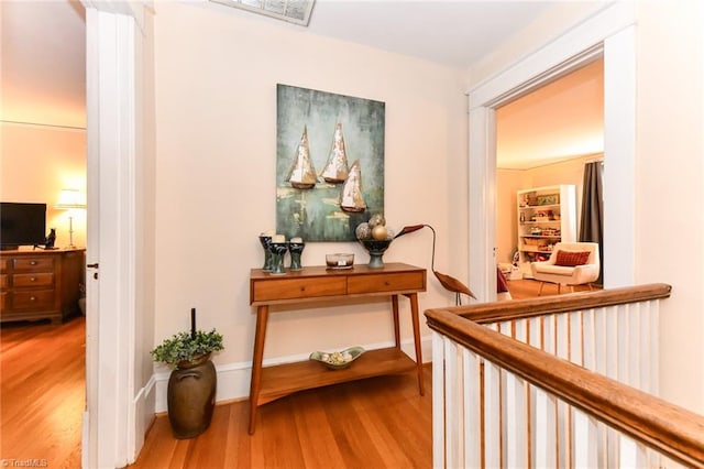 corridor featuring hardwood / wood-style flooring