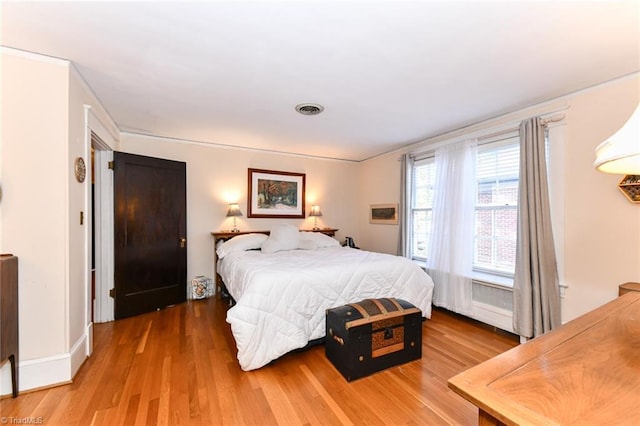 bedroom featuring wood-type flooring