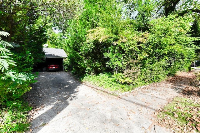 exterior space with a carport