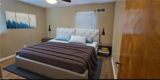 bedroom with ceiling fan and light wood-type flooring