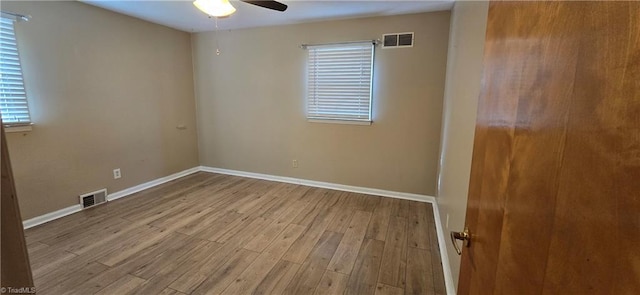 unfurnished room with ceiling fan and light wood-type flooring