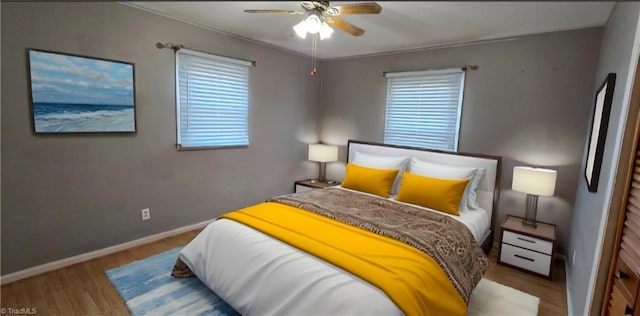 bedroom featuring wood-type flooring and ceiling fan