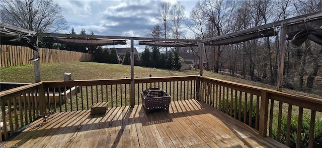 wooden deck featuring a lawn