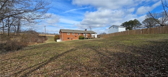 view of yard featuring a wooden deck