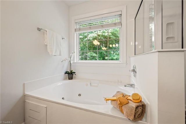 full bathroom featuring a tub with jets