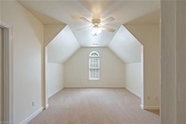 bonus room featuring light carpet, baseboards, a ceiling fan, and vaulted ceiling