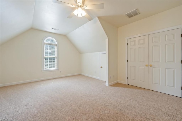 bonus room with carpet, a ceiling fan, baseboards, and vaulted ceiling