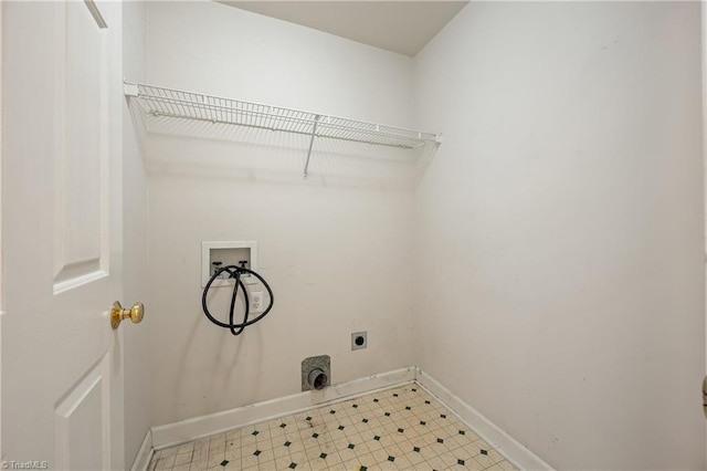 clothes washing area featuring washer hookup, electric dryer hookup, baseboards, and tile patterned floors