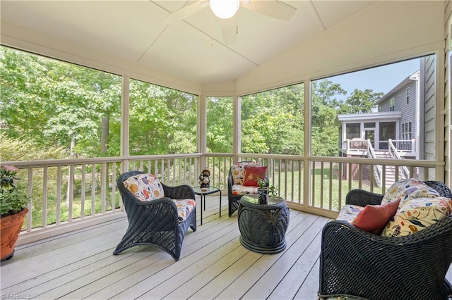 sunroom / solarium with ceiling fan, lofted ceiling, and outdoor lounge area