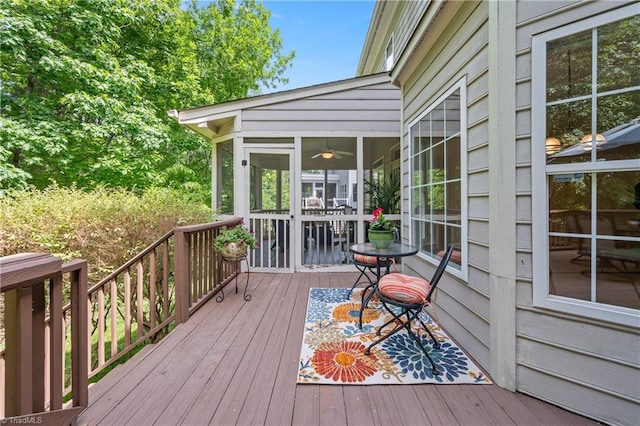 wooden deck featuring a sunroom