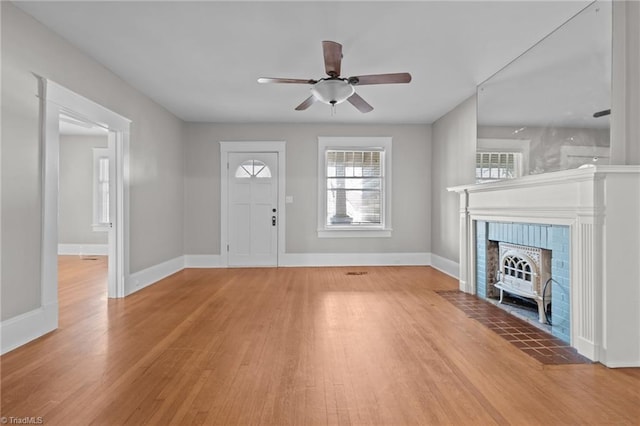 entrance foyer with ceiling fan and light hardwood / wood-style floors