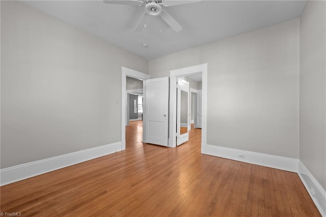 unfurnished bedroom featuring ceiling fan and light hardwood / wood-style floors