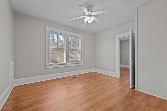 unfurnished room with ceiling fan and light hardwood / wood-style floors