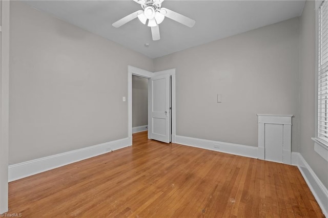 spare room featuring ceiling fan and light wood-type flooring