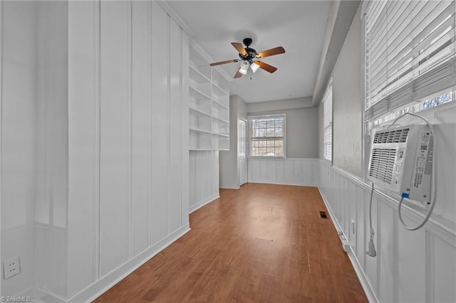 interior space featuring cooling unit and ceiling fan