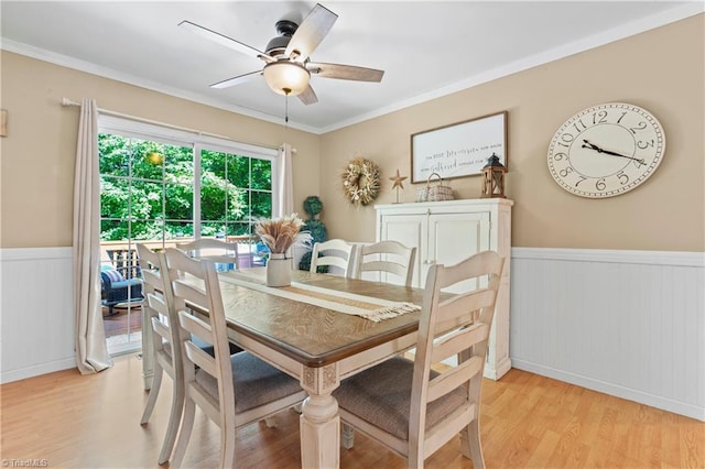1044 Riverwood Rd, Lexington, NC 27292 - dining room with wainscoting, light wood-style flooring, ceiling fan, and ornamental molding