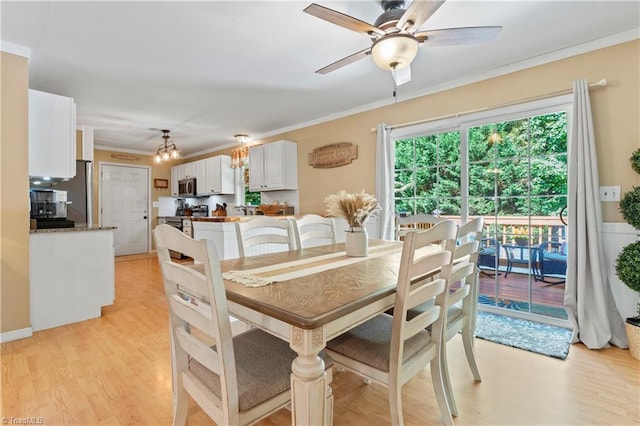 1044 Riverwood Rd, Lexington, NC 27292 - dining space with light wood-style floors, a ceiling fan, ornamental molding, and a chandelier