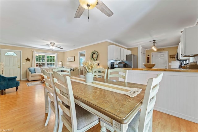 1044 Riverwood Rd, Lexington, NC 27292 - dining area with a ceiling fan, light wood-type flooring, crown molding, and baseboards