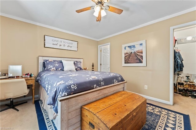 1044 Riverwood Rd, Lexington, NC 27292 - carpeted bedroom with crown molding, a walk in closet, baseboards, a closet, and a ceiling fan