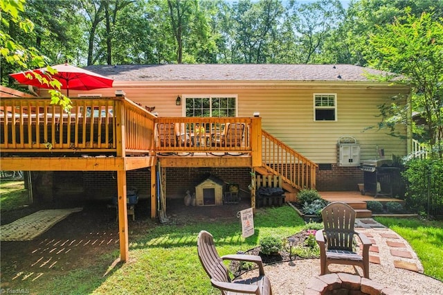1044 Riverwood Rd, Lexington, NC 27292 - rear view of house featuring a fire pit, a deck, stairway, and a yard