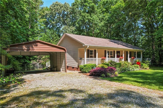 1044 Riverwood Rd, Lexington, NC 27292 - view of front of home featuring a porch, gravel driveway, a detached carport, and a front yard